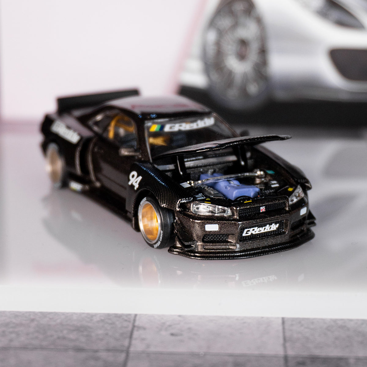 Nissan Skyline GT-R (R34) Kaido Works GReddy V2 – Black w/ Carbon